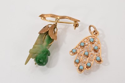 Lot 603 - Antique carved jade and 18ct gold mounted pendant in the form of a hand holding fruit, together with a gold Hasma hand set with turquoise cabochons (2)