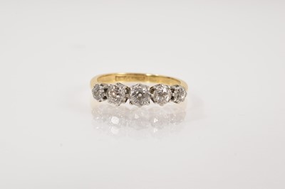 Lot 608 - Edwardian diamond five stone ring in a platinum claw setting on 18ct gold shank