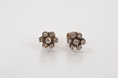 Lot 611 - Pair of antique diamond flower head cluster earrings