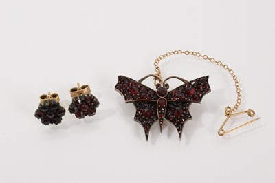 Lot 612 - 19th century Bohemian garnet butterfly brooch and a pair of garnet flower head cluster earrings