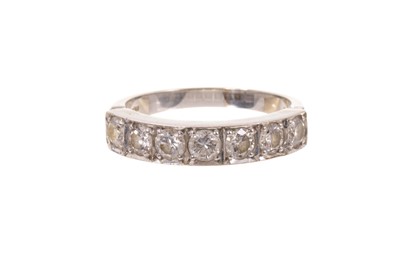 Lot 618 - Diamond seven stone half eternity ring