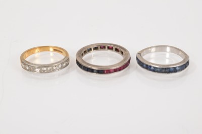 Lot 619 - Diamond half eternity ring in platinum setting on 18ct yellow gold shank, a ruby and sapphire full band eternity ring and a sapphire half eternity ring (3)
