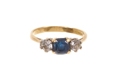 Lot 622 - Sapphire and diamond three stone ring