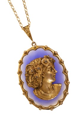 Lot 633 - Gold and blue chalcedony cameo pendant with an applied gold female bust