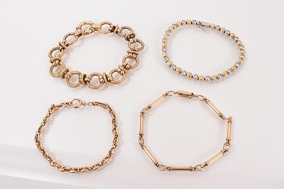 Lot 634 - 9ct yellow and white gold synthetic white stone tennis bracelet and three other 9ct gold fancy link bracelets (4)