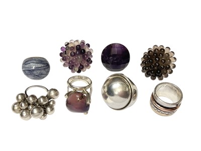 Lot 34 - Modernist white metal domed ring, signed, and seven other silver/white metal dress rings mounted with various stones (8)