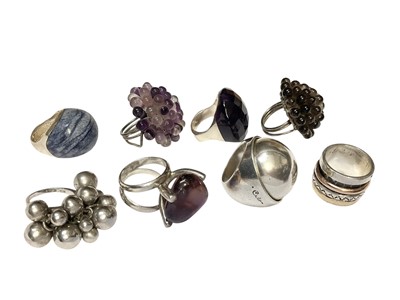 Lot 34 - Modernist white metal domed ring, signed, and seven other silver/white metal dress rings mounted with various stones (8)
