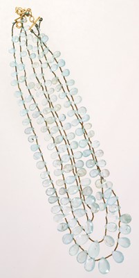 Lot 641 - Aquamarine necklace with three strings of graduated pear-cut aquamarine drops
