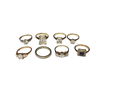 Lot 35 - Eight 9ct gold synthetic white stone dress rings