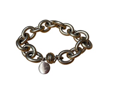Lot 43 - Gilt metal horsebit bracelet, in the style of Gucci, Ermani Bulatti gilt metal bracelet, Italian Bronzallure oval link bracelet and a gilt disc bracelet (4)