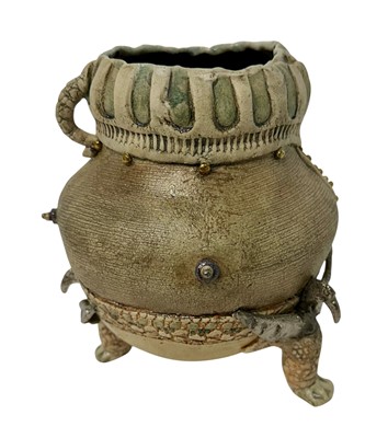 Lot 1159 - Pam Schomberg Cuckoo Farm Studios pottery vase, with silver lustre inner finish and mythical beast formed feet, signed, 19cm high