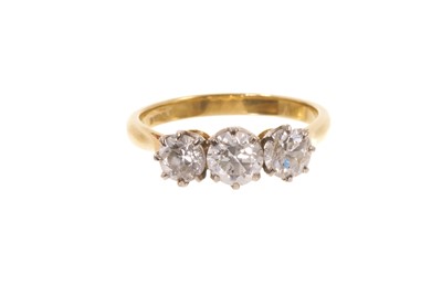 Lot 654 - Diamond three stone ring with three old cut diamonds in a claw setting on 18ct gold shank