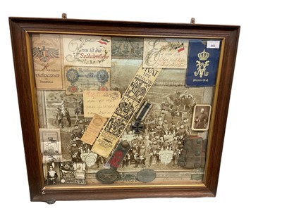 Lot 866 - Collection of Imperial German First World War militaria and ephemera mounted in glazed frame including German machine gunners badge, Iron Cross ( second Class), epaulette and cuff etc. 59 x 65cm...