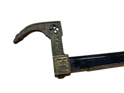 Lot 2450 - German Miner’s Guild hatchet cane from 1946, with Ebonised shaft, mounted with a symbolic, gilt metal miner’s hatchet handle and engraved presentation plaque “Fur freundlichen Erinnerung an der...