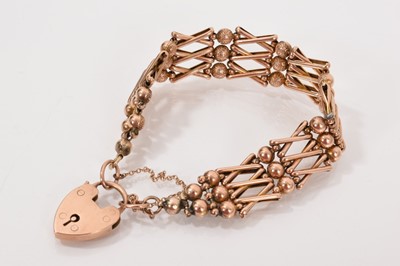Lot 666 - Edwardian 9ct rose gold bracelet with cross and ball links and a padlock clasp