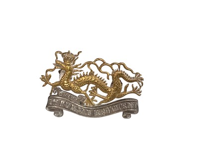 Lot 700 - Scarce Indian Army. 1st Punjab Regiment post 1922 Officer’s cap badge, inscribed “1st Punjab Regiment” with additional “China” scroll beneath the dragon’s chest.