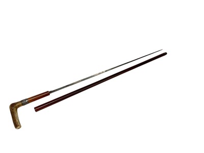Lot 883 - Victorian sword stick with tapered steel blade, in Malacca shaft with horn grip and silver collar, (Birmingham 1876), blade 70cm in length, 93.5cm in overall length.