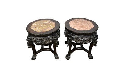 Lot 1564 - Pair of Chinese carved hardwood and marble inset stands