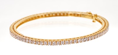 Lot 701 - Diamond bangle in gold setting
