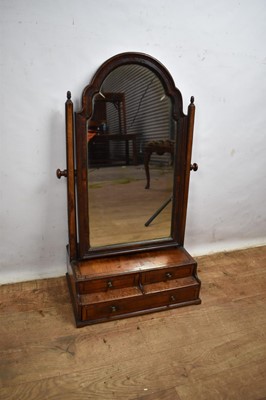 Lot 1568 - Early 18th century style walnut swing frame mirror with two tier base
