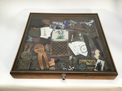 Lot 25 - Richard Drew, known as Zacron (British, 1943-2012) readymade metalwares, tarot cards, ceramics, etc - An Assemblage of objects, housed in glazed tabletop cabinet, total size 58 x 61cm