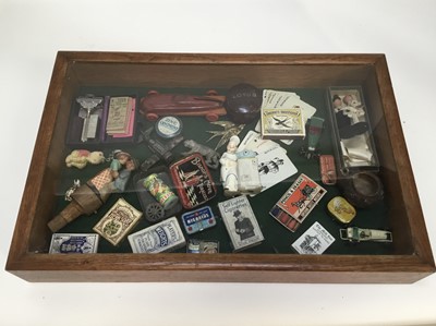 Lot 69 - Richard Drew, known as Zacron (British, 1943-2012) assemblage - Car Box 1983, juxtaposition of childhood images that offer continual stimulation, in glazed tabletop display case, 35 x 53cm