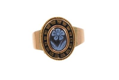 Lot 562 - Victorian carved sardonyx and black enamel mourning ring with a central cameo carved forget-me-not with a black enamel border on a tapered gold shank. Ring size N
