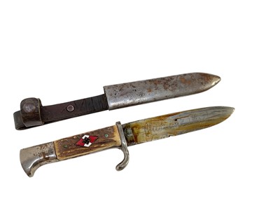 Lot 851 - Nazi Hitler Youth knife / dagger with two piece stag horn grip, set with enamel swastika badge, plated mounts, engraved blade marked 'Blut und Ehre!' RZM M7/27 1938, in scabbard