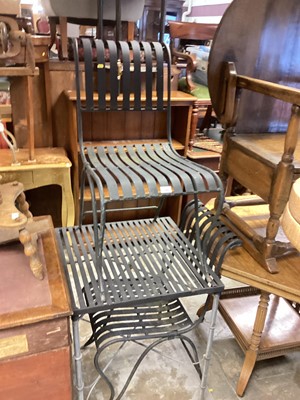 Lot 1365 - Two heavy iron garden chairs and matching table