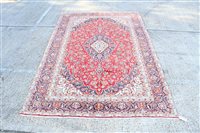 Lot 1760 - Kashan carpet - brick-red field with...
