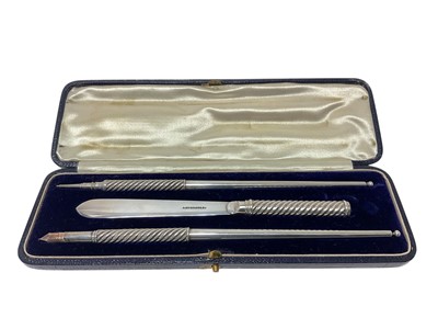 Lot 397 - Victorian silver three piece desk set by Samson Morden, cased...