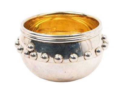 Lot 387 - Edwardian silver copy of The Glastonbury Bowl, with ball decoration and silver gilt interior (Birmingham 1908) Joseph Gilmore. All at approximately 2ozs. 8.5cm diameter.