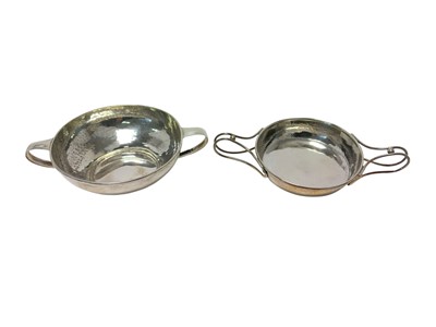 Lot 398 - Arts and Crafts beaten silver twin-handled bowl by A E Jones, and ano...