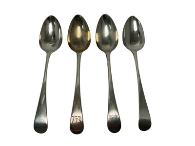 Lot 382 - Pair of George III silver serving spoons with engraved armorial and another pair. (4)