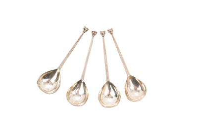 Lot 375 - Set of four seal end spoons by the Guild of Handicrafts