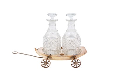 Lot 366 - Silver plate novelty table carriage decanter, in the form of a boat, named 'Jolly Roger'