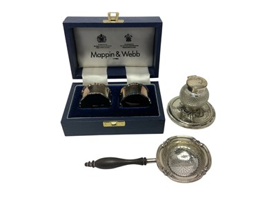 Lot 326 - Cased silver napkin rings together with a tea strainer and silver cut glass ink well