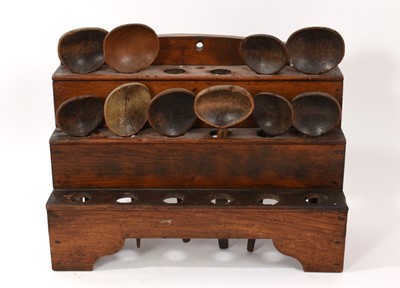 Lot 1010 - 18th elm three tier spoon rack with various wooden spoons