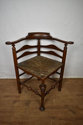 Lot 1672 - Ornate 18th century oak framed corner chair with rush seat