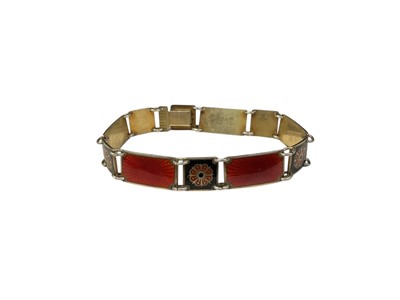 Lot 9 - David Andersen Norwegian silver, red and black enamel panel bracelet with flower head decoration