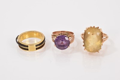 Lot 707 - Yellow metal mounted elephant hair ring, Middle-Eastern gold faux alexandrite ring and a gold citrine cocktail ring (3)