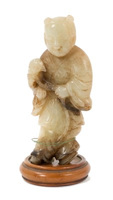 Lot 819 - Chinese jade carving of a falconer, 18th / 19th century