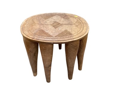 Lot 1386 - African tribal stool, raised on multiple tapered supports