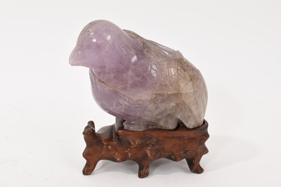 Lot 866 - Antique Chinese carved amethyst figure of a bird, on hardwood stand