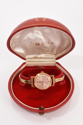 Lot 766 - 1960s ladies 18ct gold cased Omega wristwatch on 9ct gold bracelet, boxed