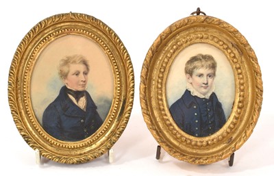 Lot 906 - Pair of 19th century portrait miniatures on paper of boys in blue coats, possibly brothers