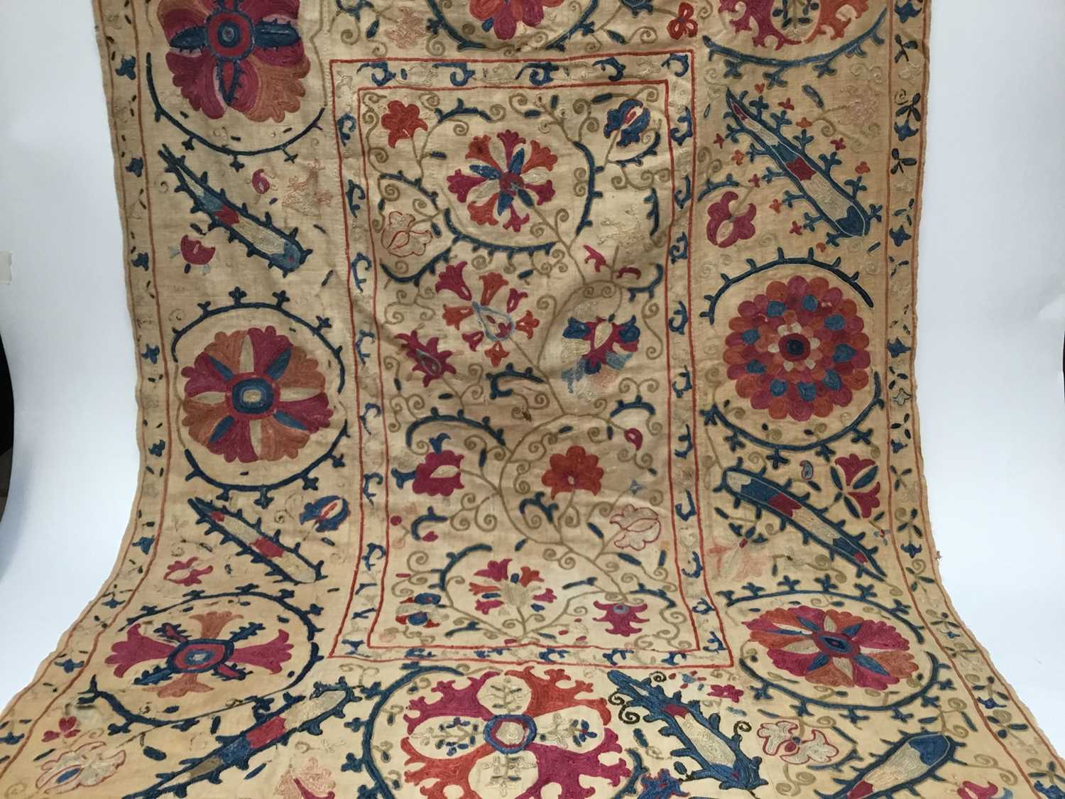 Lot 2050 - Antique embroidered Suzani with scrolling foliage on cream ground