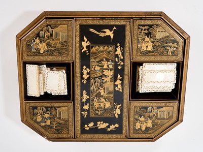 Lot 898 - Late 18th / early 19th century Chinese black lacquered gaming box, housing card trays and lidded compartments containing a fine collection of armorial carved Chinese mother of pearl playing cou...