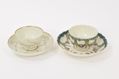 Lot 27 - A Worcester fluted tea bowl and saucer, circa 1775, polychrome painted with swags of flowers in Hop Trellis style, on turquoise scale ground, the saucer 13.5cm diameter, together with a Queen's...