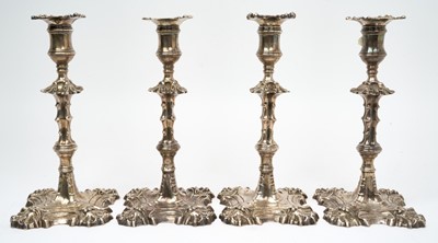 Lot 252 - Set of four George II cast silver candlesticks, 1756/7 William Grundy